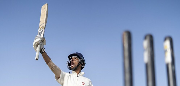 Cricketer celebrating a mileston