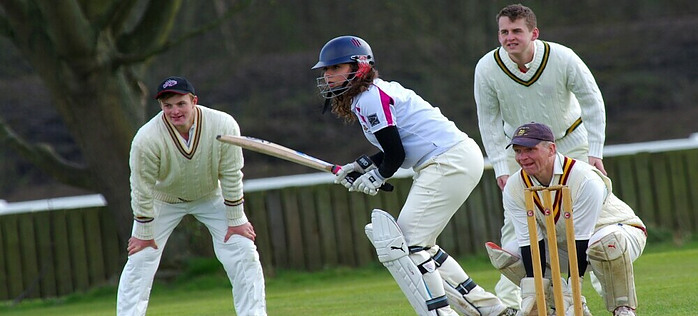 People playing Cricket