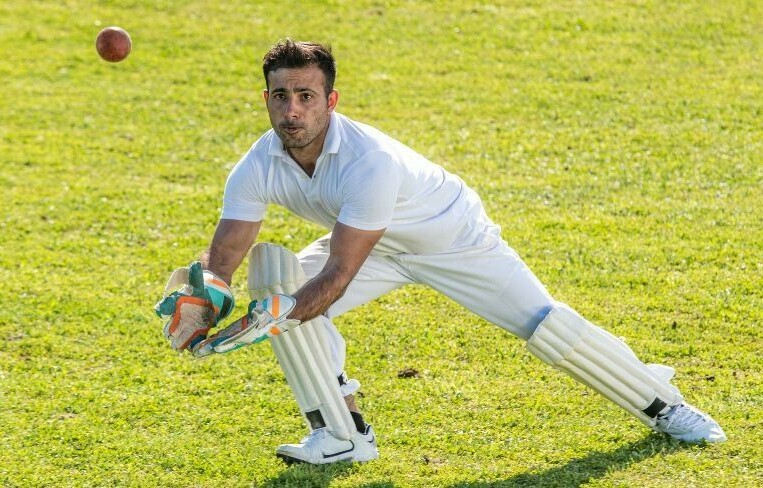 Wicket keeper wearing gloves and pads