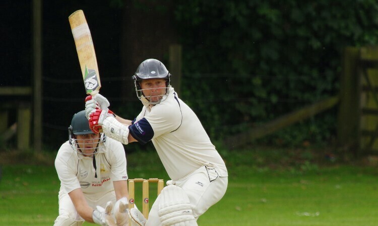 man with cricket bat